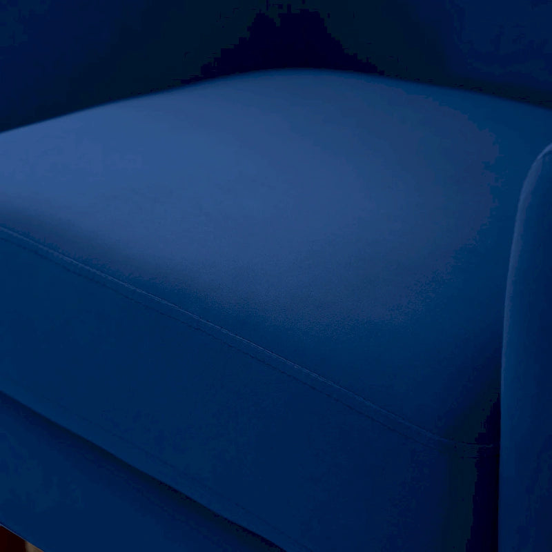 Fauteuil en velours avec pieds en bois massif