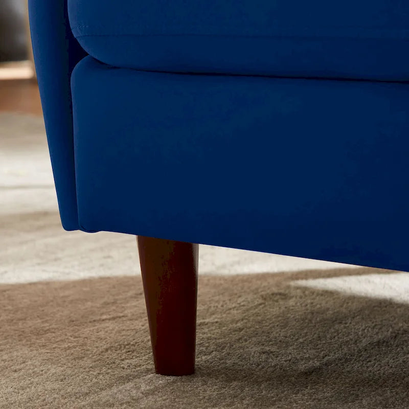 Fauteuil en velours avec pieds en bois massif