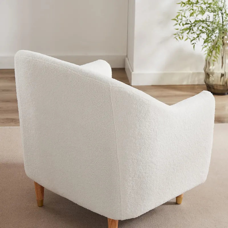 Fauteuil en velours avec pieds en bois massif