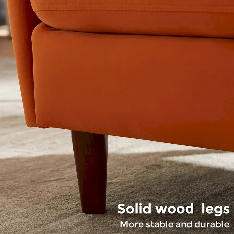 Fauteuil en velours avec pieds en bois massif